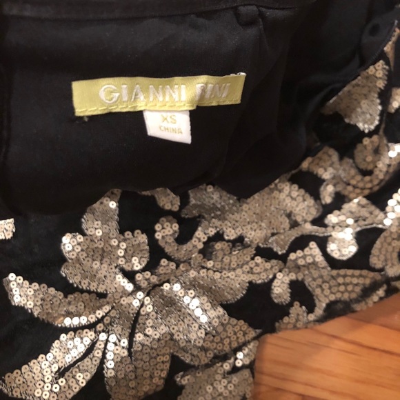 Sexy little black dress with gold accents! - Picture 2 of 2